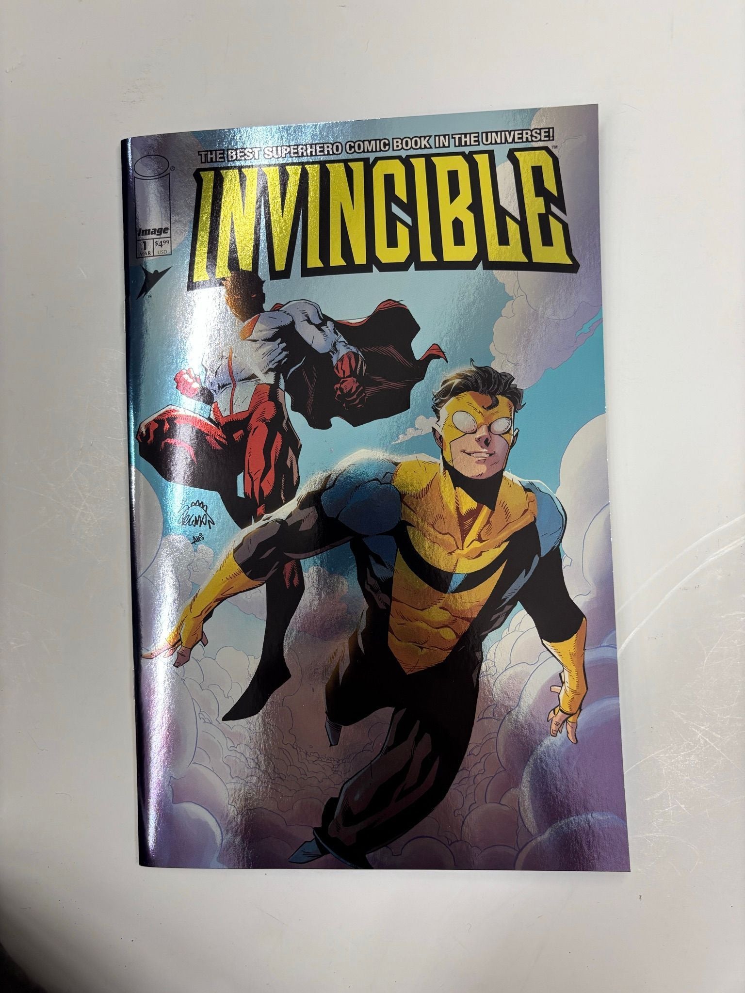 Invincible #1 foil flying with omniman variant